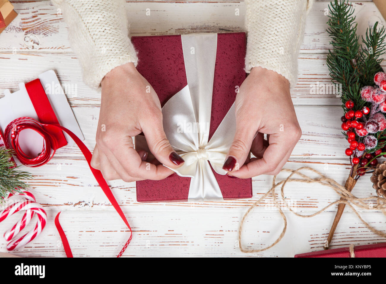 woman-wrapping-a-present-box-KNYBP5.jpg