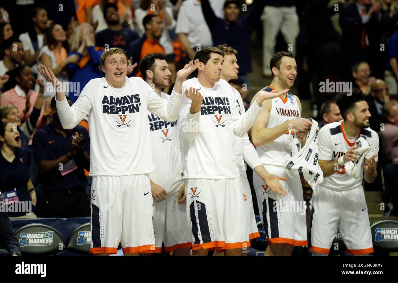 players-on-virginia-bench-react-to-a-play-during-the-first-half-of-a-college-basketball-game-against-syracuse-in-the-regional-finals-of-the-ncaa-tournament-sunday-march-27-2016-in-chicago-ap-photonam-y-huh-2N00KXY.jpg