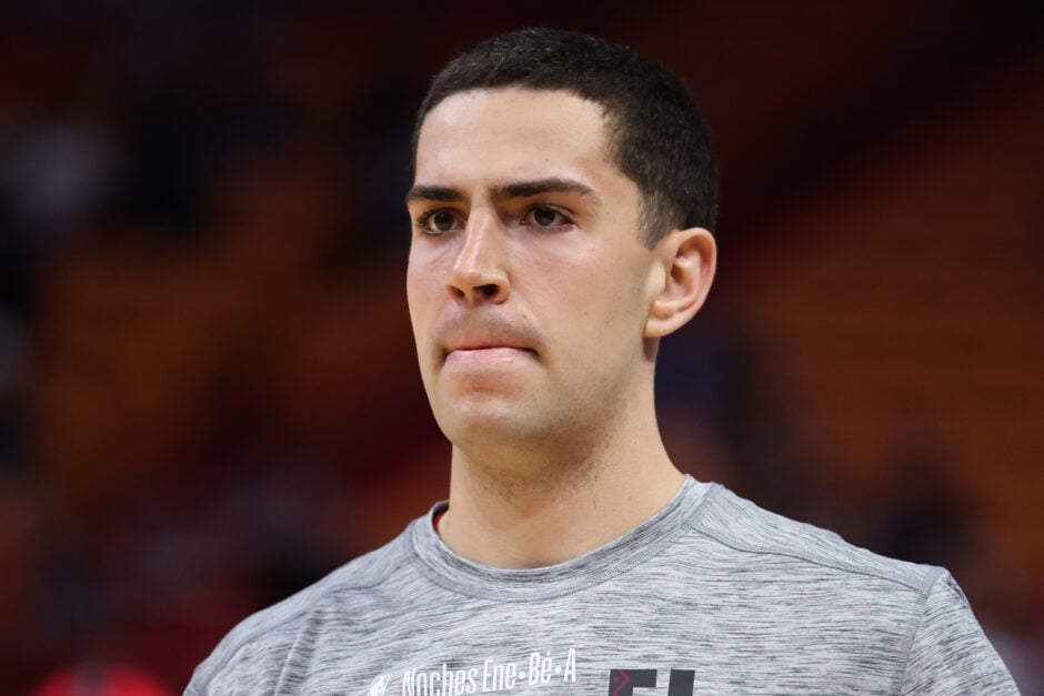 Cole Swider #21 of the Miami Heat warms up prior to a game against the Detroit Pistons.
