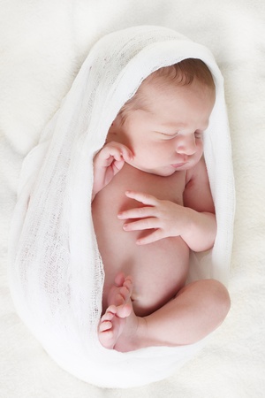 9655650-newborn-baby-girl-asleep-on-a-blanket.jpg