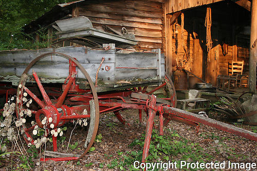 Broken-down-horsedrawn-farm-wagon-in-front-of-abandoned-house.jpg