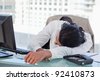 stock-photo-businessman-sleeping-on-his-desk-in-his-office-92410873.jpg