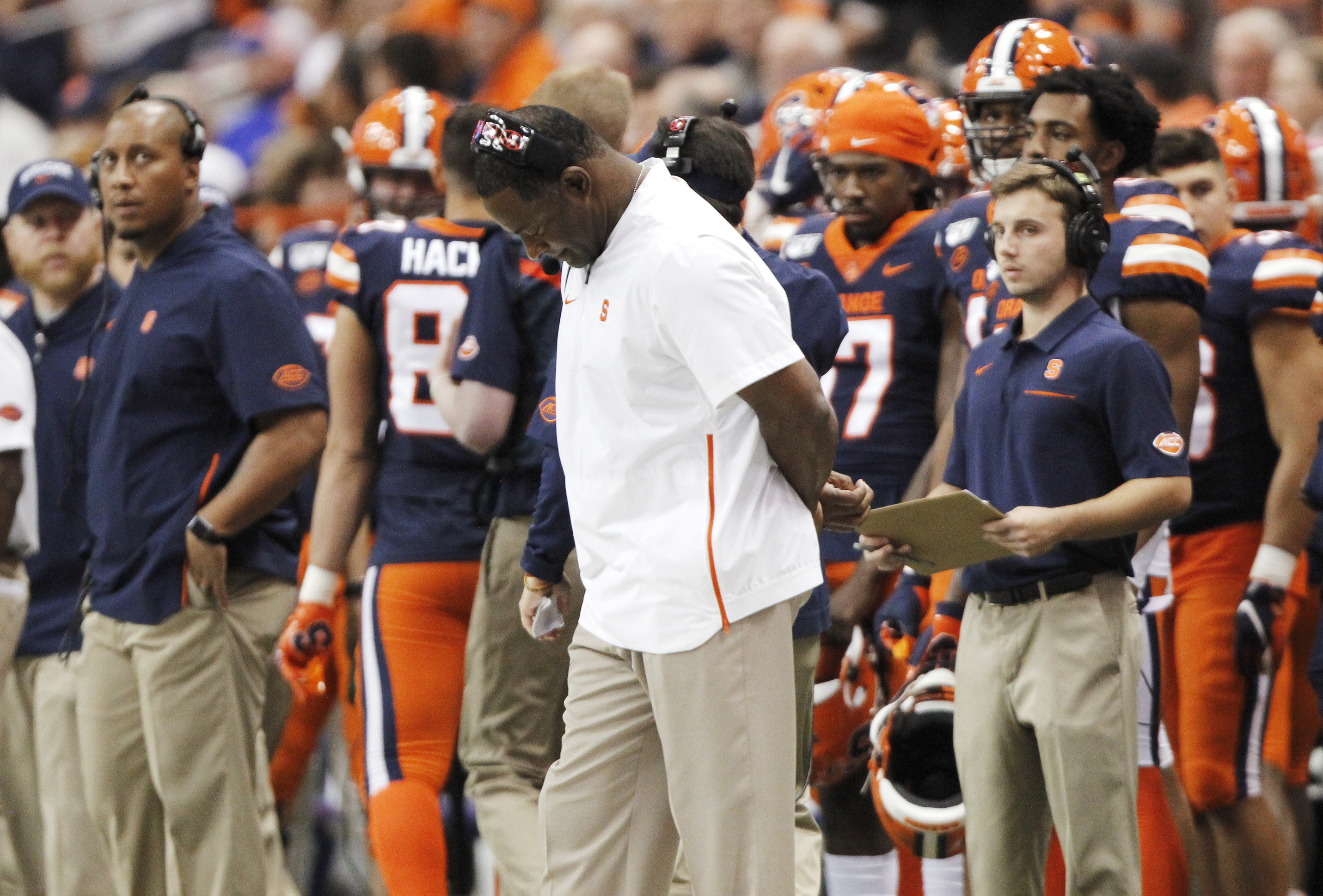 Syracuse coach Dino Babers looks down in the final minutes of the team's NCAA college football game against Pittsburgh in Syracuse, N.Y., Friday, Oct. 18, 2019. Pittsburgh won 27-20. (AP Photo/Nick Lisi)