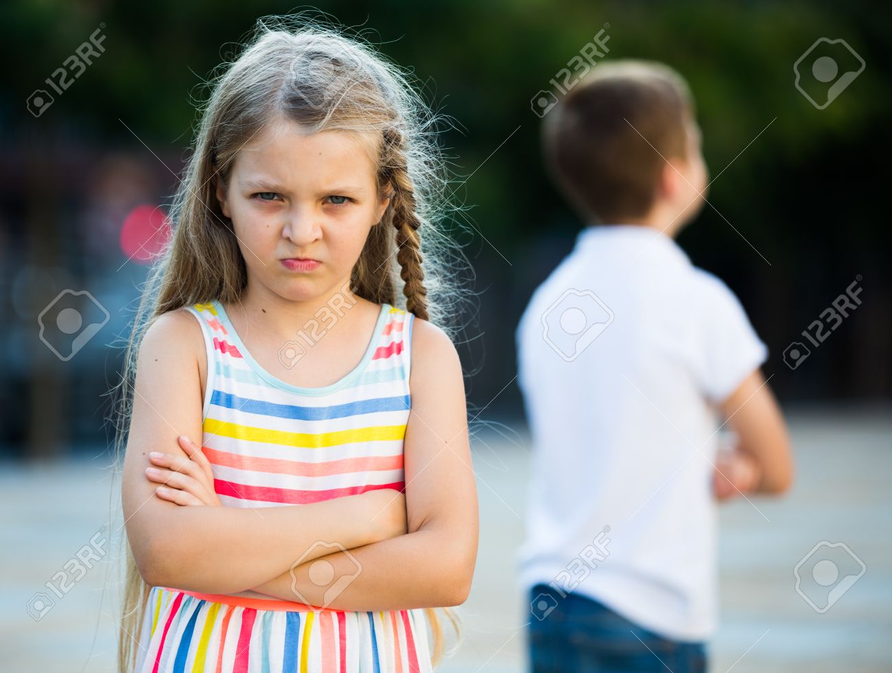 85347398-portrait-of-angry-girl-in-elementary-school-age-not-playing-with-friend-in-park-outdoors.jpg
