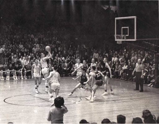 Jim Boeheim, a Lyons Central basketball star over 60 years ago, shoots during the 1962 Section V Class AA championship game against East Rochester. ER's Bombers won a 59-58 double overtime thriller in front of 11,000 at the War Memorial on Saturday, March 24, 1962.