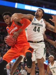Michigan State's Nick Ward goes for the rebound against