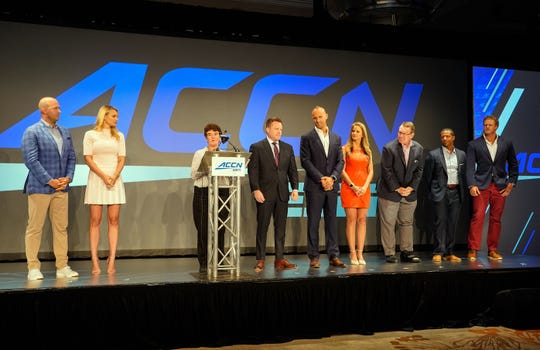 The fledgling ACC Network introduced its Game day talent for the upcoming football season -- from left, Matt Hasselbeck, Katie George , Chris Cotter, Mark Herzlich, Kelsey Riggs, Wes Durham, Roddy Jones, and Eric Wood --during the 2019 ACC Kickoff in Charlotte.