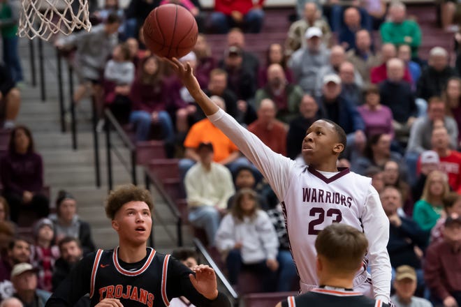 Gettysburg's Quadir Copeland floats through the air to score on a layup and put the Warriors up 24-21 in the second quarter against York Suburban on Wed., Jan. 29, 2020.