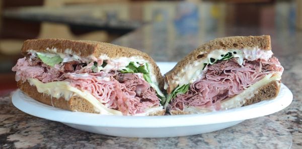 The Brooklyn Pickle Special sandwich, with corned beef, pastrami, Swiss cheese, Russian dressing and dark rye bread. Photo by Peter Chen / The Post-Standard.